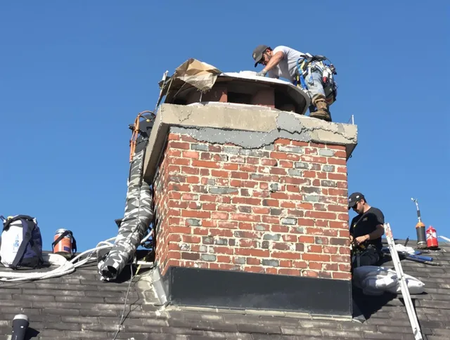 Hartford Chimney Sweep installing a custom chimney crown in Hartford, CT