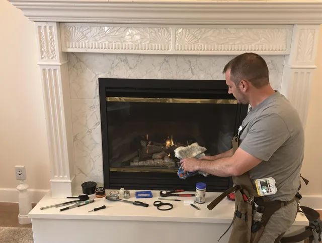 Hartford Chimney Sweep performing fireplace maintenance in Hartford, CT
