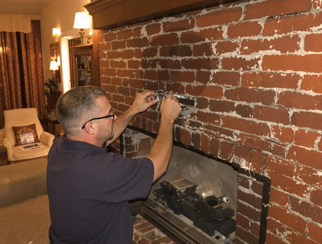 Hartford Chimney Sweep expert fixing a fireplace in Hartford, CT